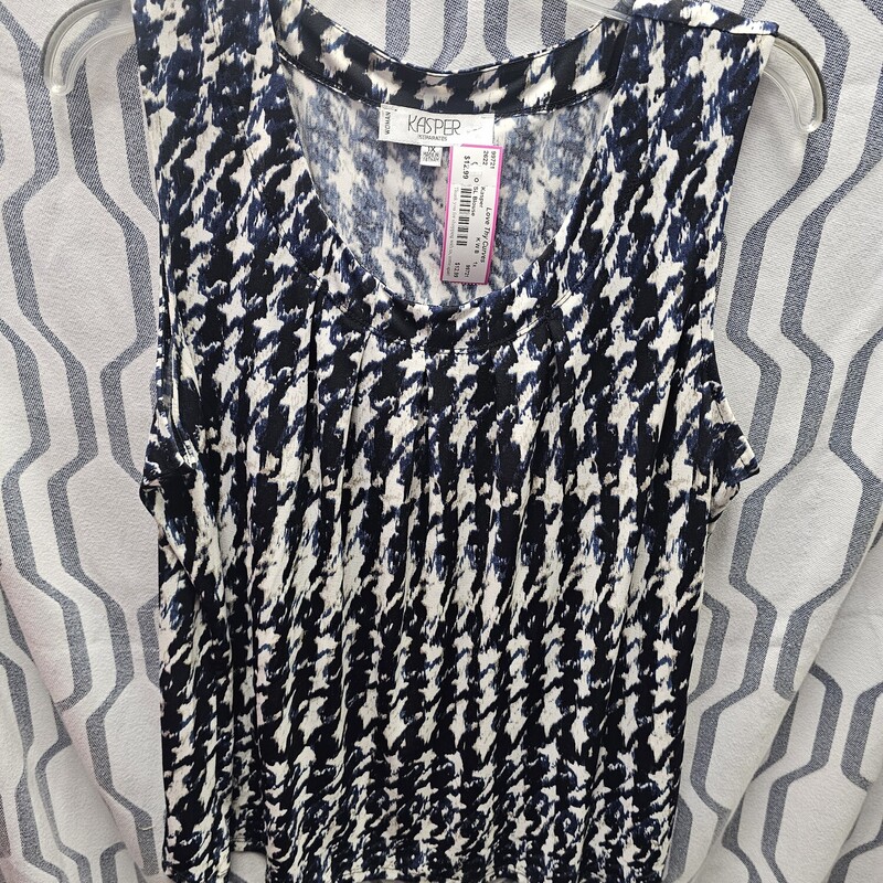Sleeveless blouse in a black, blue, white and tan pattern