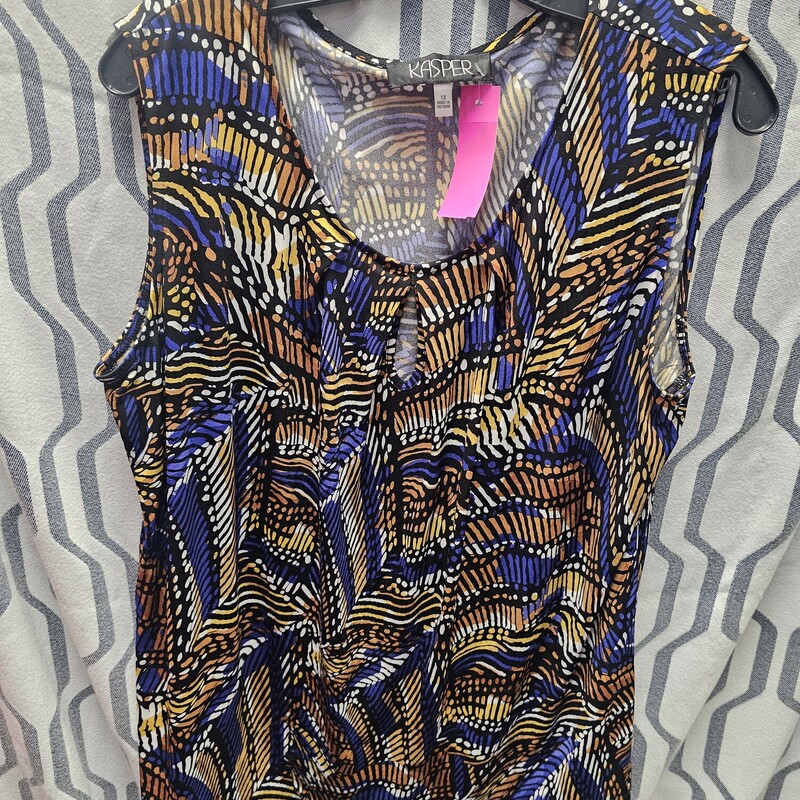 Sleeveless blouse in a black, white yellow/gold and blue pattern.