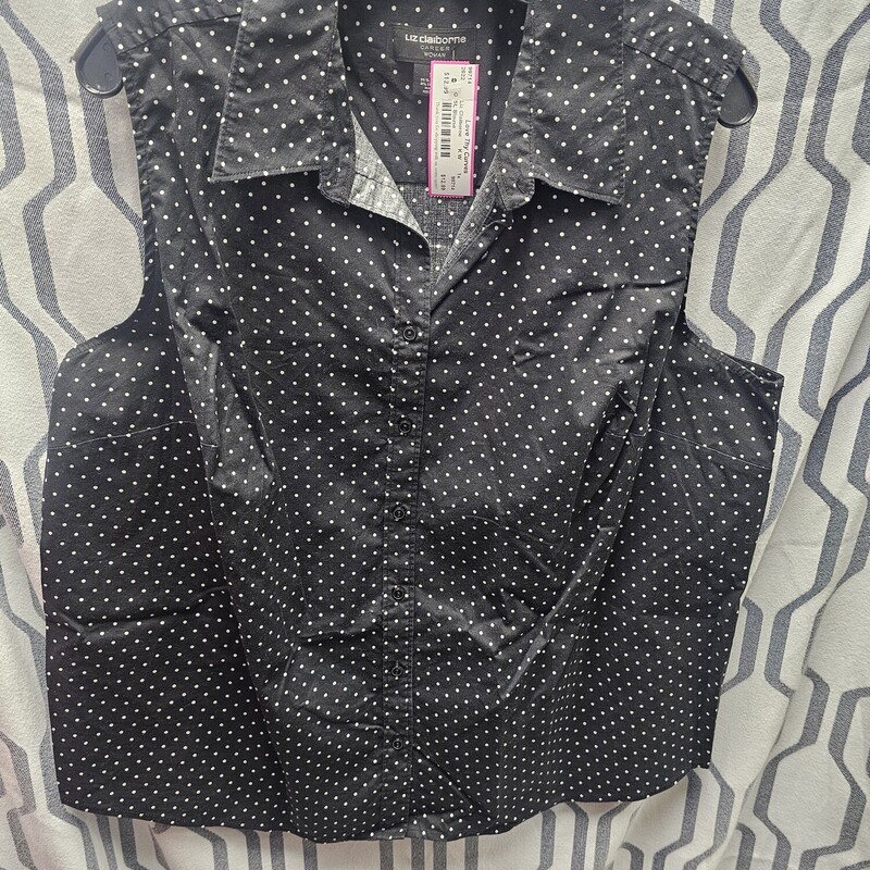 Sleeveless black blouse with button up front and white polka dots