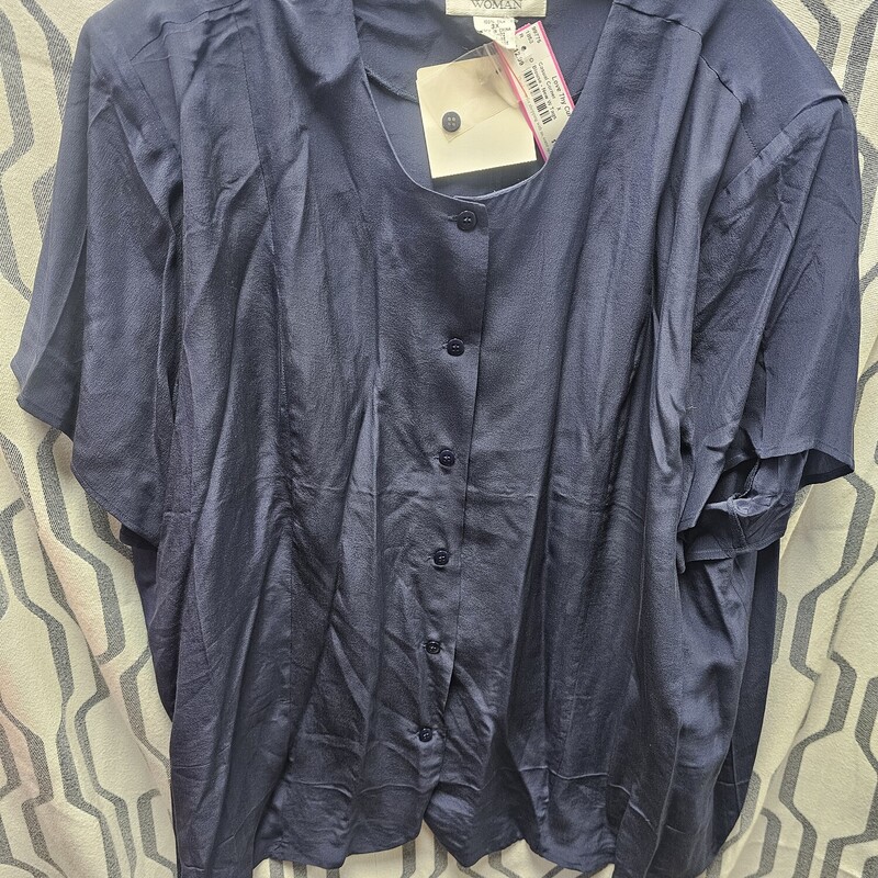 Brand new with tags, navy blue short sleeve blouse with button up front and shoulder pads.