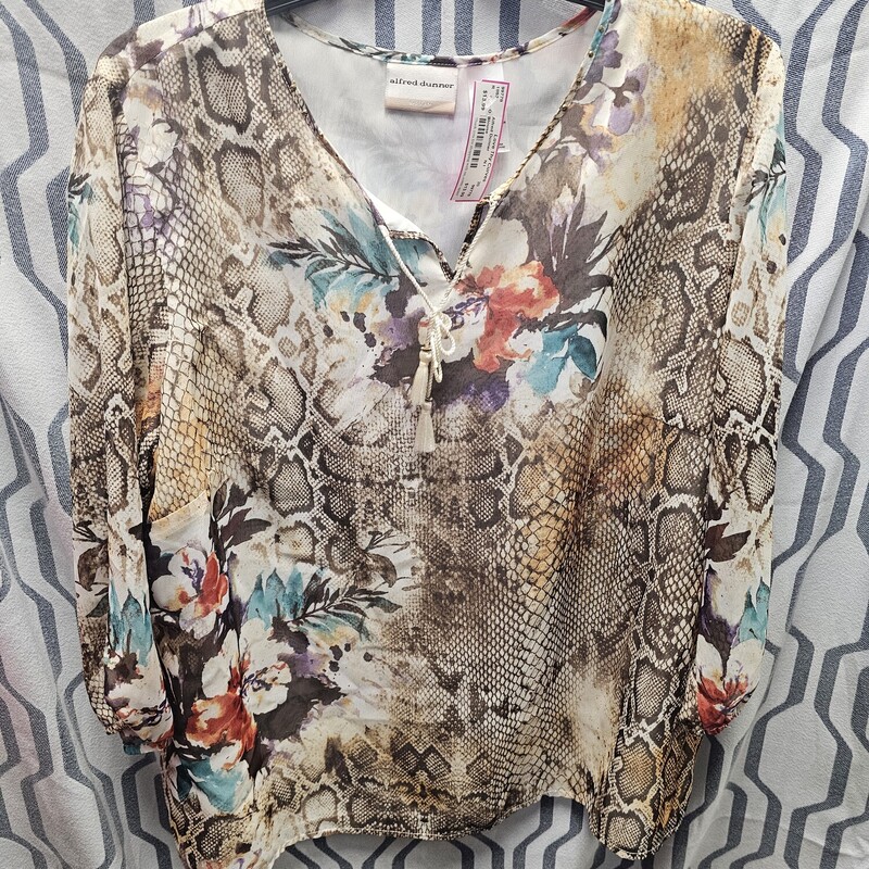 Gorgeous blouse in beige and browns with floral and animal prints.