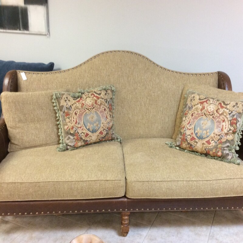This is a unique Lexington Sofa with leather frame, with beige upholstered cushions.  Size: 78\" long