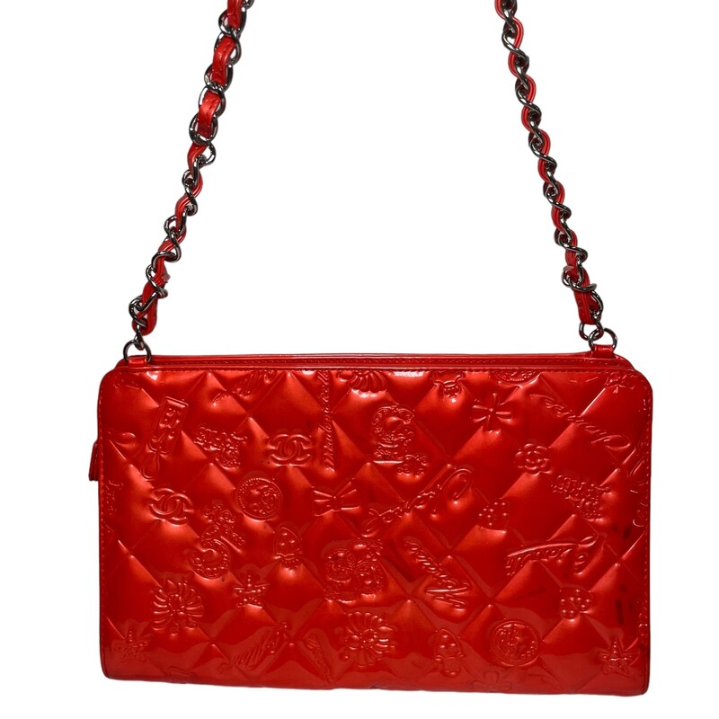 CHANEL Patent Calfskin Lucky Symbols Pochette in Red. This stylish bag is crafted of diamond embossed patent calfskin leather in a shade of red. It features a leather threaded silver chain link handle and iconic lucky charm symbols embossed on the front and rear. The flap opens to a gray satin interior with a patch pocket.

Some color transference
See photos for refrence
Dimensions:
Base length: 8.75 in
Height: 6.25 in
Width: 2.75 in
Drop: 8.00 in