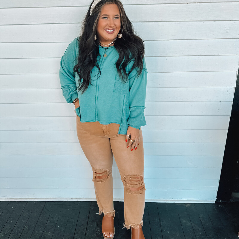 This lightweight-oversized sweater top is perfect for layering or for pairing with pants and cute booties!
Madison is wearing a size Medium.