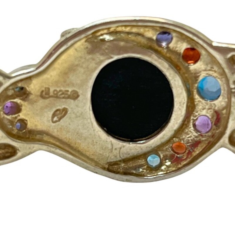 Vintage Carolyn Pollack ‘Moondance’ Sterling Silver<br />
Cuff Bracelet<br />
Limited-Edition Collection<br />
A twisting frame of Sterling Silver entwines with the natural rainbow obsidian cabochon, embraced by a sparkling series of amethyst, blue topaz, garnet and iolite gemstones.