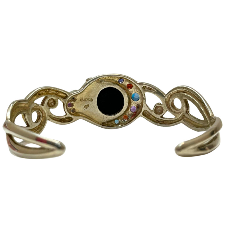 Vintage Carolyn Pollack ‘Moondance’ Sterling Silver<br />
Cuff Bracelet<br />
Limited-Edition Collection<br />
A twisting frame of Sterling Silver entwines with the natural rainbow obsidian cabochon, embraced by a sparkling series of amethyst, blue topaz, garnet and iolite gemstones.