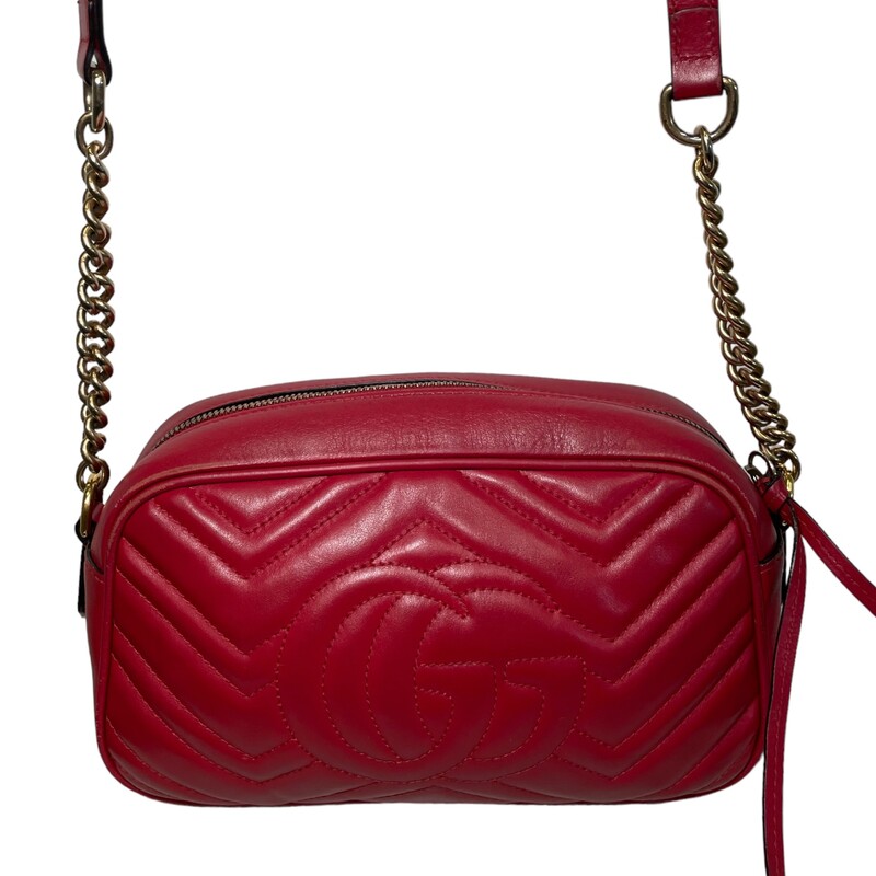 Gucci Marmont Camera Bag<br />
Crafted from red matelassé leather, this small GG Marmont chain shoulder bag has a softly structured shape and a zip top closure with the Double G hardware. The chain shoulder strap has a leather shoulder detail.<br />
Some scratches and corner wear<br />
Some light discoloration on hardware<br />
Dimensions: Small size: 9.5W x 5H x 3D
