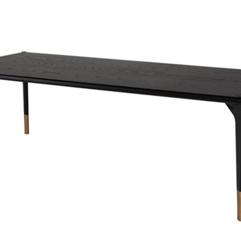 Neuvo Quattro Dining Table
Dark Brown Wood with Gold Leg Caps
Size: 79 x 40 x 30H
Retails: $3400.00
Understated with refined hints of glamour the Quattro Dining Table makes a confident and poised statement. The dignified simplicity of the onyx oak veneer top, oak legs and polished lines are underscored by stylish gold hardware.