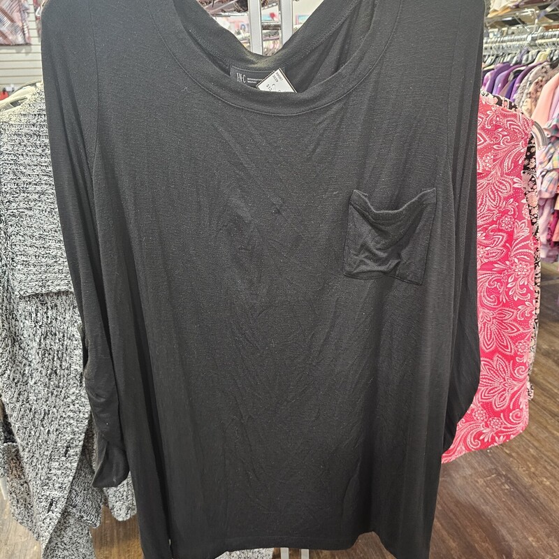 Half sleeve knit top in black with rouging on the sleeves for added style.