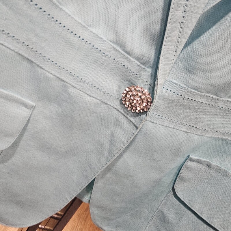 Super cute light weight blouse in a blue with rhinestone button.