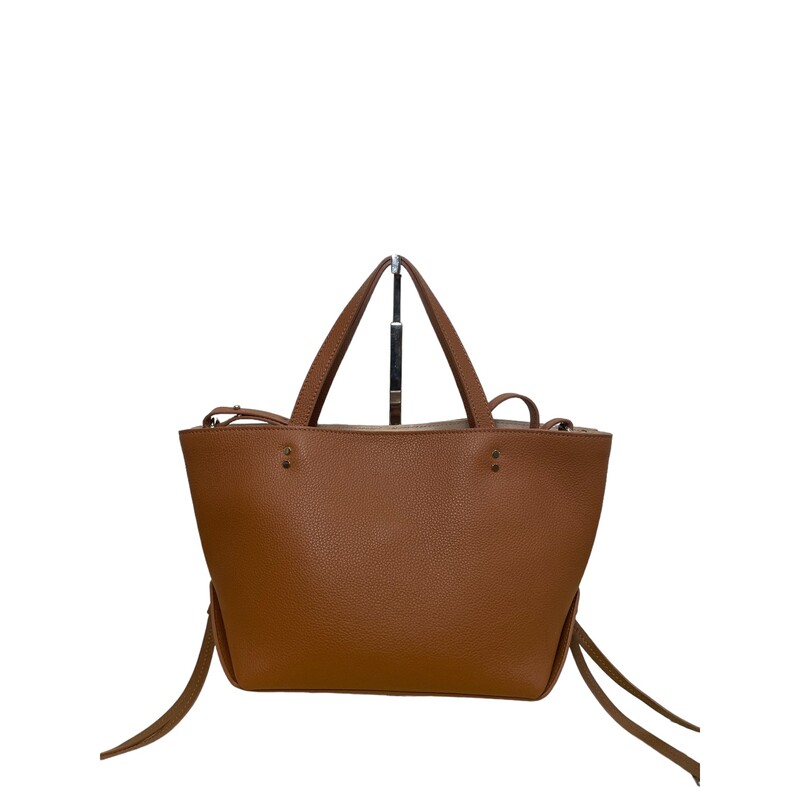 Chloe Sense East West  2023
Tan leather and gold-tone hardware give this tote a classic yet modern feel, complemented by a logo-embroidered removable small zippered purse.
Dimensions:
13 inches wide
7.5 inches high,
 5.5 inches deep,