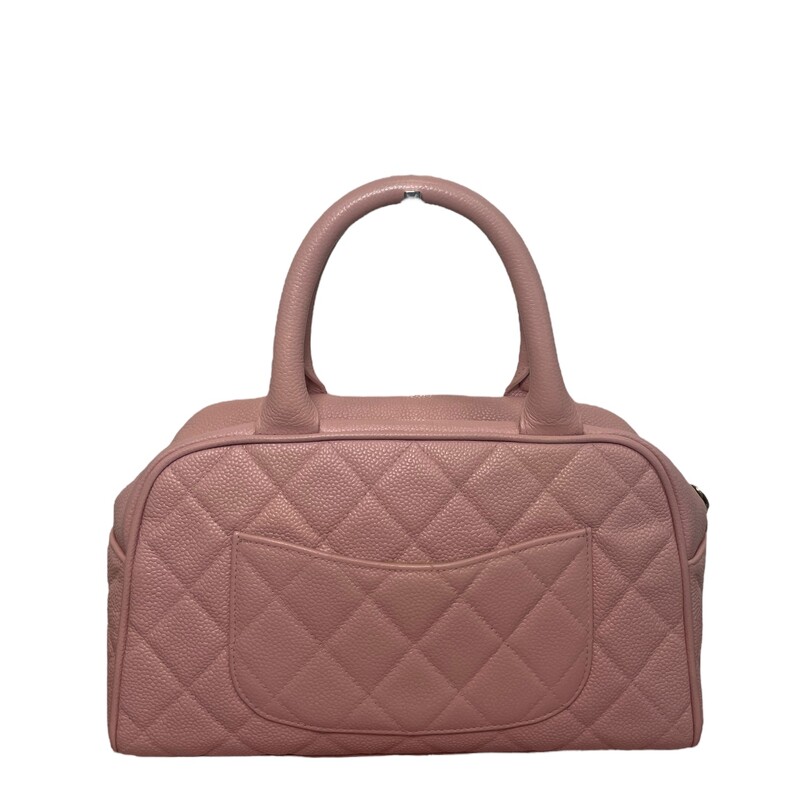 Chanel quilted pink caviar leather Bowling handbag, CC logo stitched to one side, slot pocket to the other, dual handles over zipper opening and tan lined interior with single zip pocket. Spacious interior to fit your daily essentials.
Year: 2003-2004
Dimensions:10Lengthx 6Height
Some minor pen marks inside
