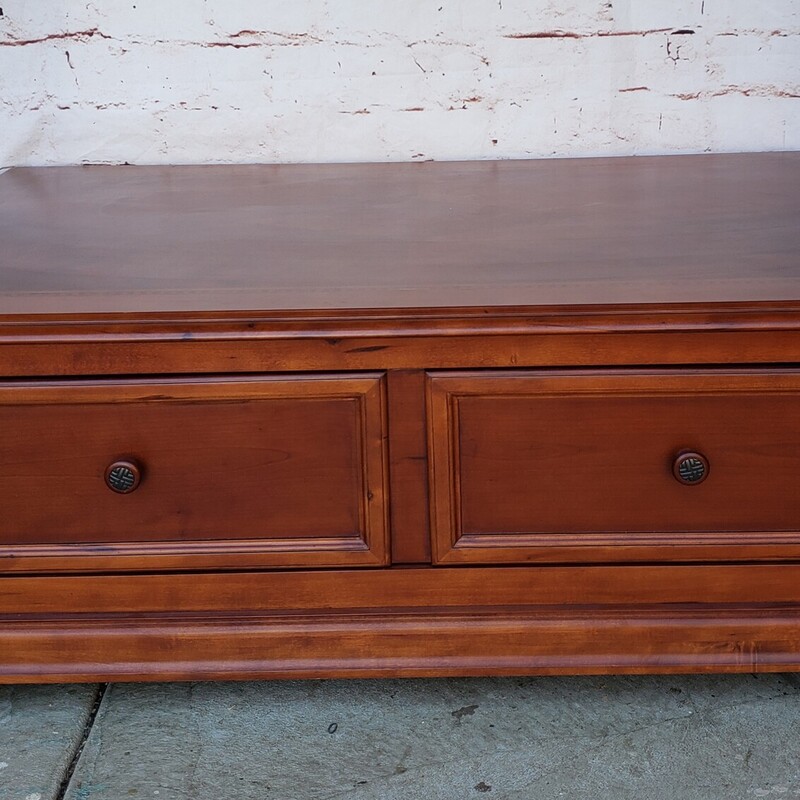 Wood Coffee Table with pass through drawer. AS IS Has some water marks in the finish on top. Otherwise  in good conditon. Size: 30W x 18T x 50L