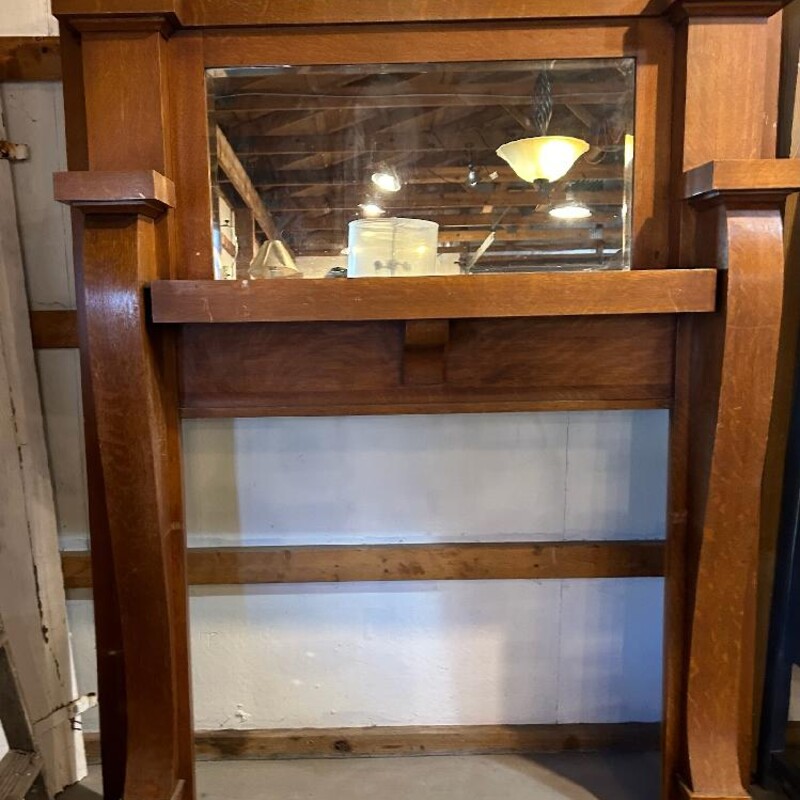 Antique Fireplace Mantel with Mirror. Made from Oak. In good condition with some wear. Has a few nail holes. Overall size: 73in Tall x 60in Wide x 13in Deep. Opening size: 41.5in Wide x 39in Tall.