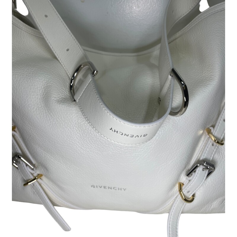 Givenchy Voyou Handbag White

Size: Medium

Dimensions:
15.75 in x 10.63 in x 2.56 in
Adjustable shoulder strap length from 11.4 to 39.8 in.
Minimal drop : 6.3 in and maximal drop : 21.2 in.

Medium shoulder bag in tumbled calfskin leather.
Voyou line.
V-shaped slouchy silhouette.
Adjustable shoulder strap offering hand, shoulder or crossbody carrying.
GIVENCHY engraved metal buckles.
Golden and silvery-finish metal details.
GIVENCHY signature embossed on the front of the bag and on the top of the shoulder strap.
One main compartment and one inside zipped pocket.