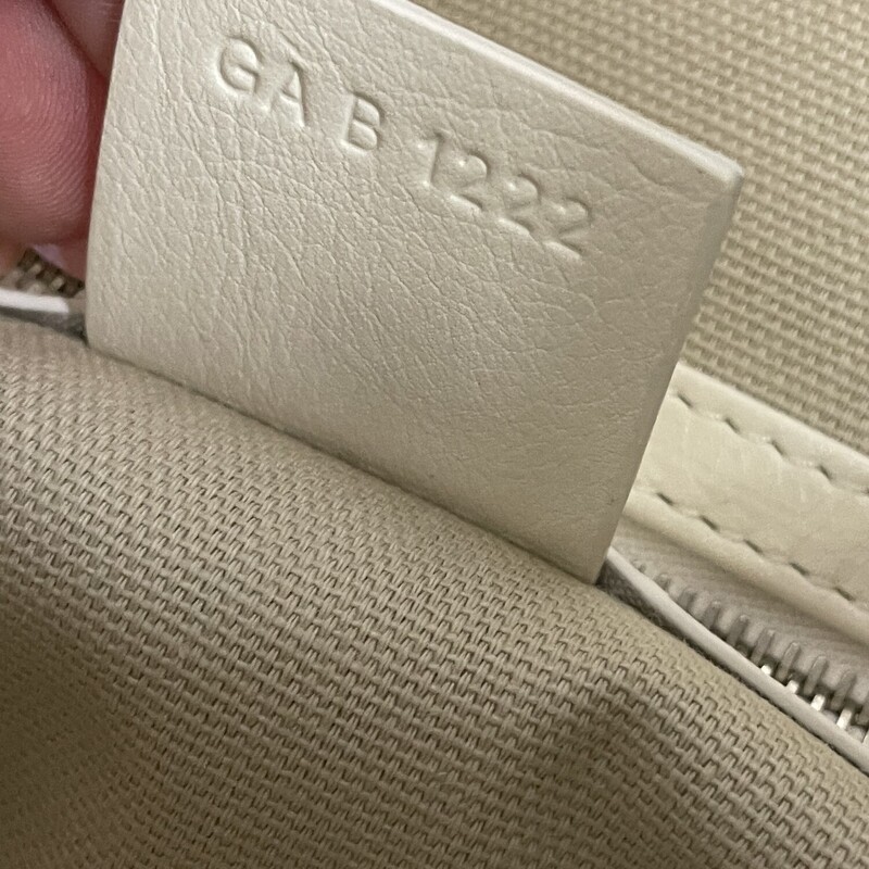 Givenchy Voyou Handbag White<br />
<br />
Size: Medium<br />
<br />
Dimensions:<br />
15.75 in x 10.63 in x 2.56 in<br />
Adjustable shoulder strap length from 11.4 to 39.8 in.<br />
Minimal drop : 6.3 in and maximal drop : 21.2 in.<br />
<br />
Medium shoulder bag in tumbled calfskin leather.<br />
Voyou line.<br />
V-shaped slouchy silhouette.<br />
Adjustable shoulder strap offering hand, shoulder or crossbody carrying.<br />
GIVENCHY engraved metal buckles.<br />
Golden and silvery-finish metal details.<br />
GIVENCHY signature embossed on the front of the bag and on the top of the shoulder strap.<br />
One main compartment and one inside zipped pocket.