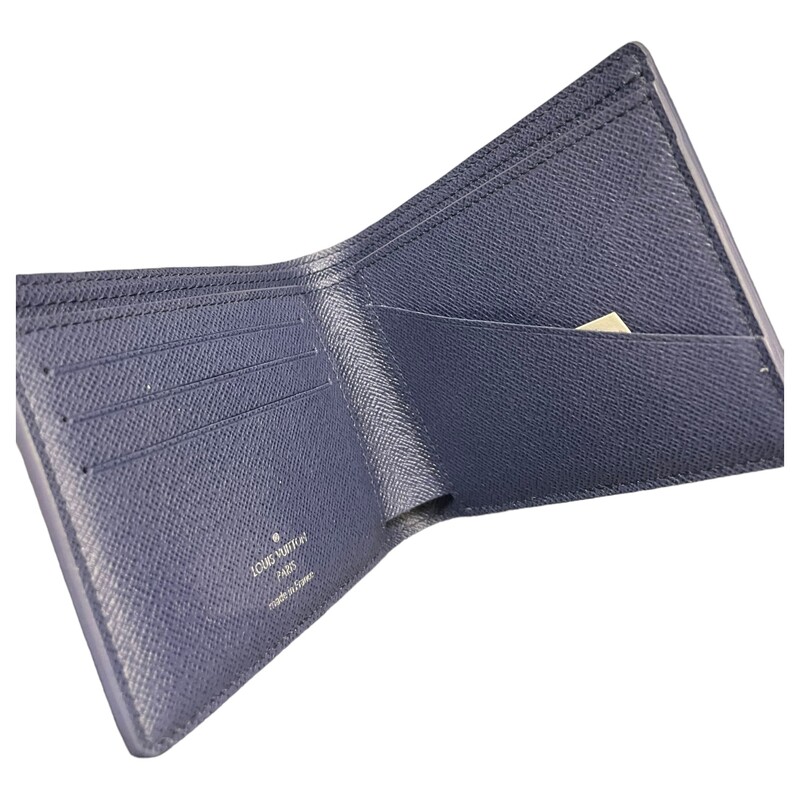 Louis Vuitton Watercolor Bifold

Color: Blue

Dimensions:
Length: 4.75 in
Width: 0.75 in
Height: 3.50 in

This is an authentic LOUIS VUITTON Monogram Watercolor Multiple Wallet. This stylish compact mens wallet is finely crafted of classic Louis Vuitton monogram on toile canvas in blue. The wallet opens to a blue cross grain leather interior with card slots, patch pockets, billfold slots.