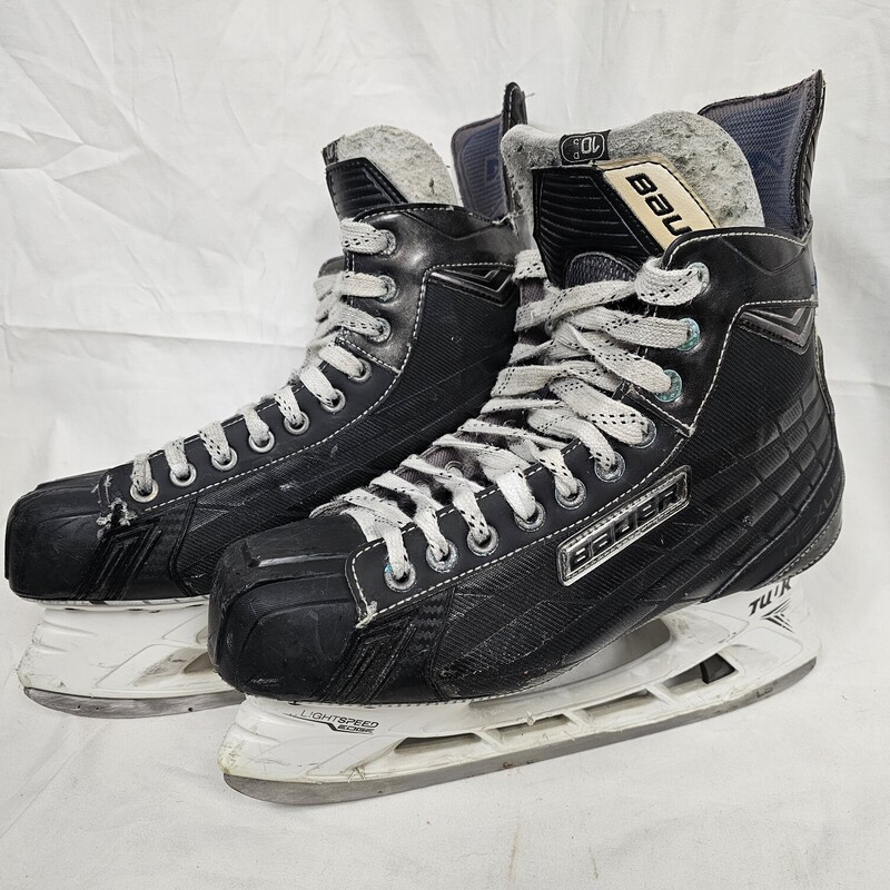 Pre-owned Bauer Nexus 7000 Hockey Skates, Size: 10.5, Shoe size 12.  Quick change blade set up.  Shows wear around inside ankle area and eyelets. MSRP $599.99