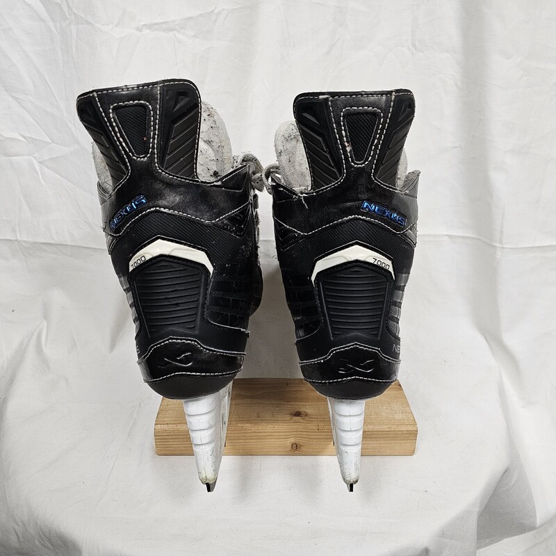 Pre-owned Bauer Nexus 7000 Hockey Skates, Size: 10.5, Shoe size 12.  Quick change blade set up.  Shows wear around inside ankle area and eyelets. MSRP $599.99