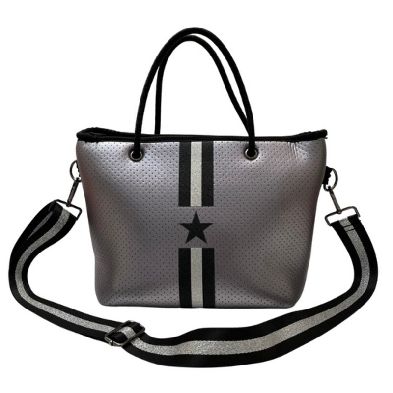 Haute Shore Grayson Tote Handbag and Wristlet<br />
<br />
This neoprene compact zip-top tote goes from day to night with its streamline design<br />
Top handles and removable crossbody strap.<br />
Lined interior with zip pocket and removable wristlet pouch<br />
Dimensions- 10 inches wide x 7.5 inches tall x 5.5 inches<br />
Colors: Silver and Black