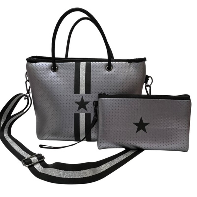 Haute Shore Grayson Tote Handbag and Wristlet

This neoprene compact zip-top tote goes from day to night with its streamline design
Top handles and removable crossbody strap.
Lined interior with zip pocket and removable wristlet pouch
Dimensions- 10 inches wide x 7.5 inches tall x 5.5 inches
Colors: Silver and Black