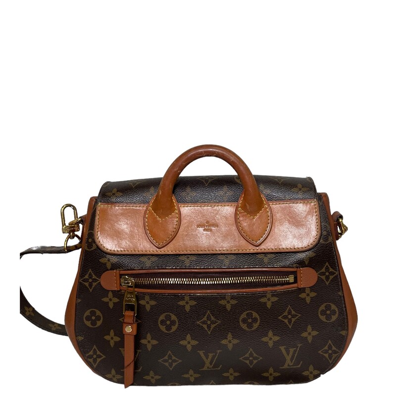 Louis Vuitton Eden 2 Way Bag<br />
Size MM<br />
Date Code : AR2132<br />
This versatile handbag is crafted of traditional monogram toile canvas and features a unique mix of rich calfskin and natural vachetta leather. This bag has a steamer-inspired top handle, an optional monogram coated canvas shoulder strap, and a vachetta leather base. Polished brass signature hardware is found at the frontal press lock, the strap links, and the feet. The front flap opens to a partitioned cocoa microfiber interior with zipper and flat pockets.