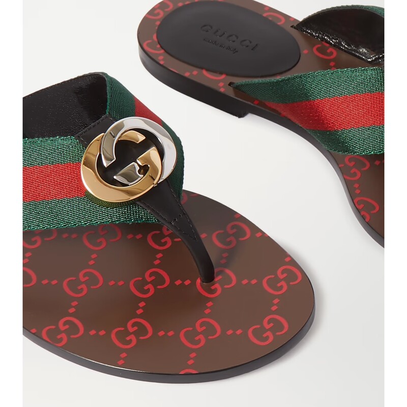 GUCCI<br />
GG THONG WEB SANDAL<br />
Bringing several House elements together, the thong sandal combines green and red Web straps with a GG patterned sole and Interlocking G hardware in a modern mix of silver- and gold-toned metals.<br />
<br />
Green and red nylon Web with black leather trim<br />
Gold- and silver-toned hardware<br />
Interlocking G<br />
Leather sole with GG pattern<br />
Square toe<br />
Flat<br />
.2\" height<br />
Made in Italy<br />
Comes with Original GUCCI box & Shoe Bags<br />
Retails: 595.00<br />
These Sandals are in like NEW condition