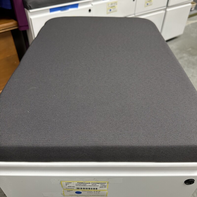 Kimbell Office Filing Cabinet on Wheels, White Metal with Gray Upholstered top. New and Never Used! Has a Key for Locking.<br />
Size: 15L x 23D x 23H