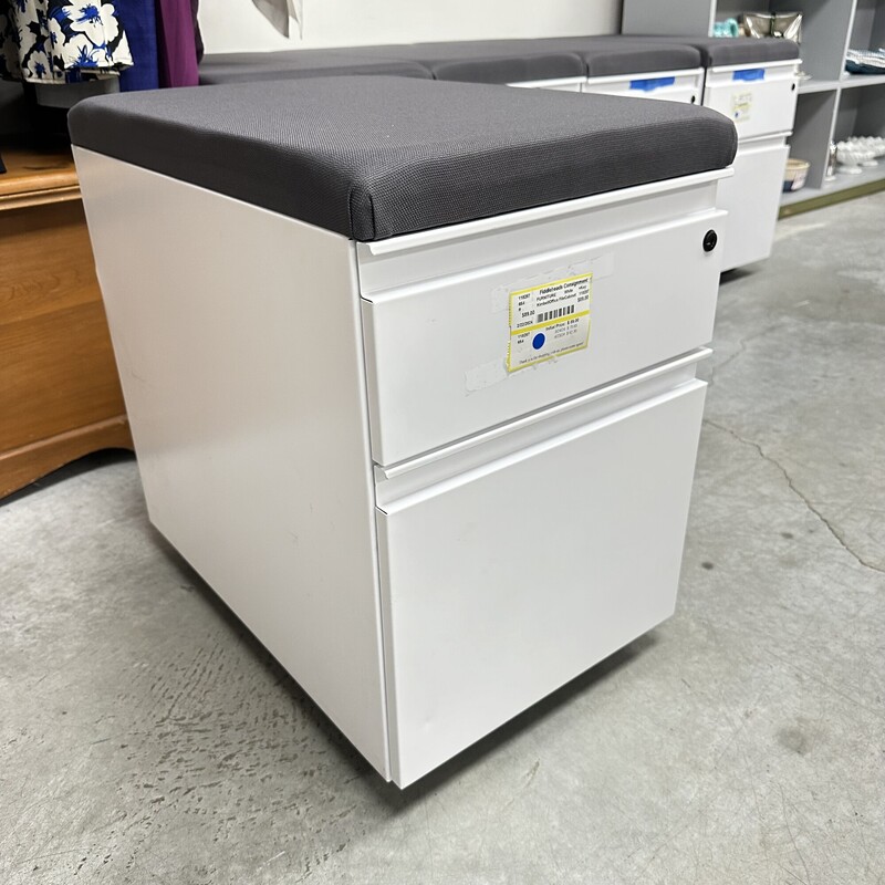 Kimbell Office Filing Cabinet on Wheels, White Metal with Gray Upholstered top. New and Never Used! Has a Key for Locking.<br />
Size: 15L x 23D x 23H