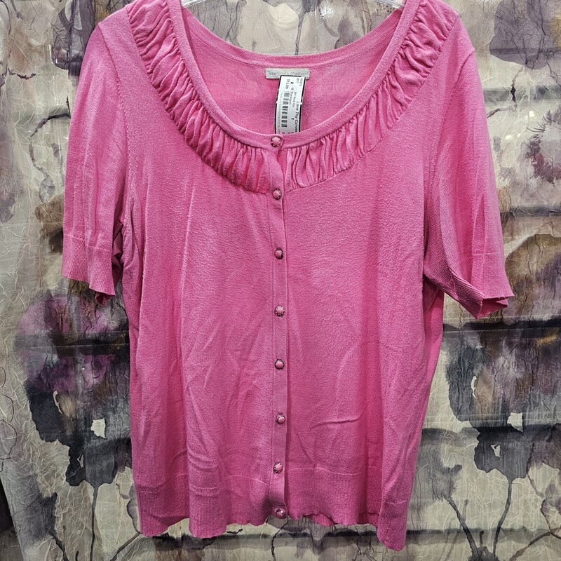 Cute and dainty, this short sleeve pink cardigan has button up front.