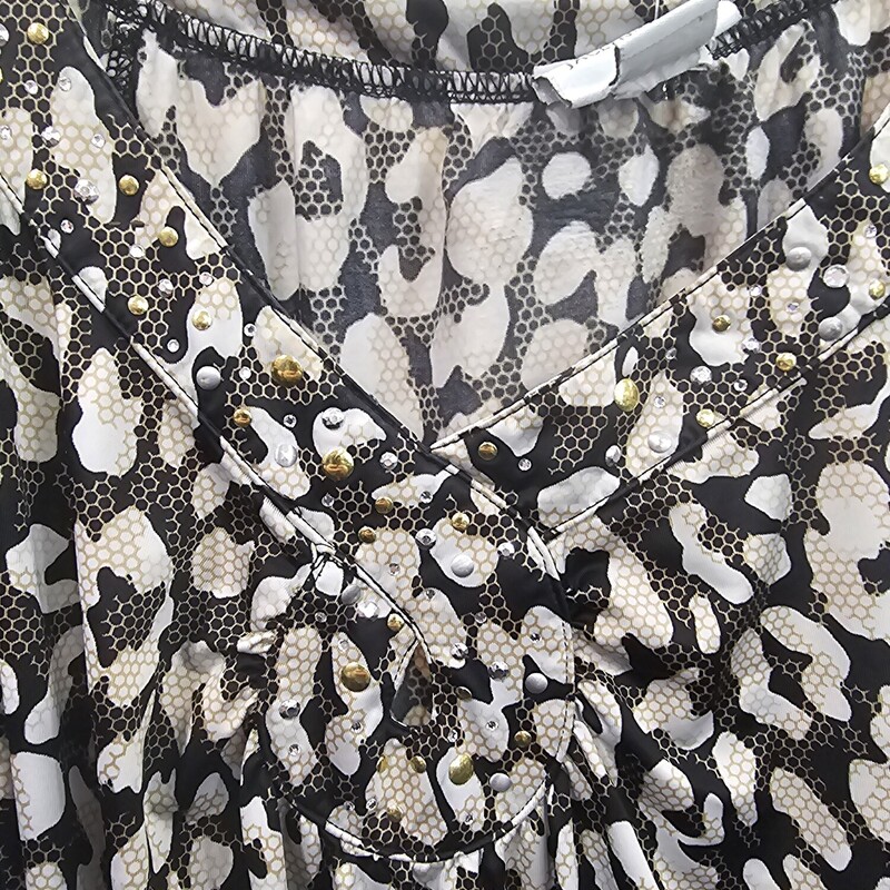 Short sleeve blouse in black and white print with gold and silver studding.