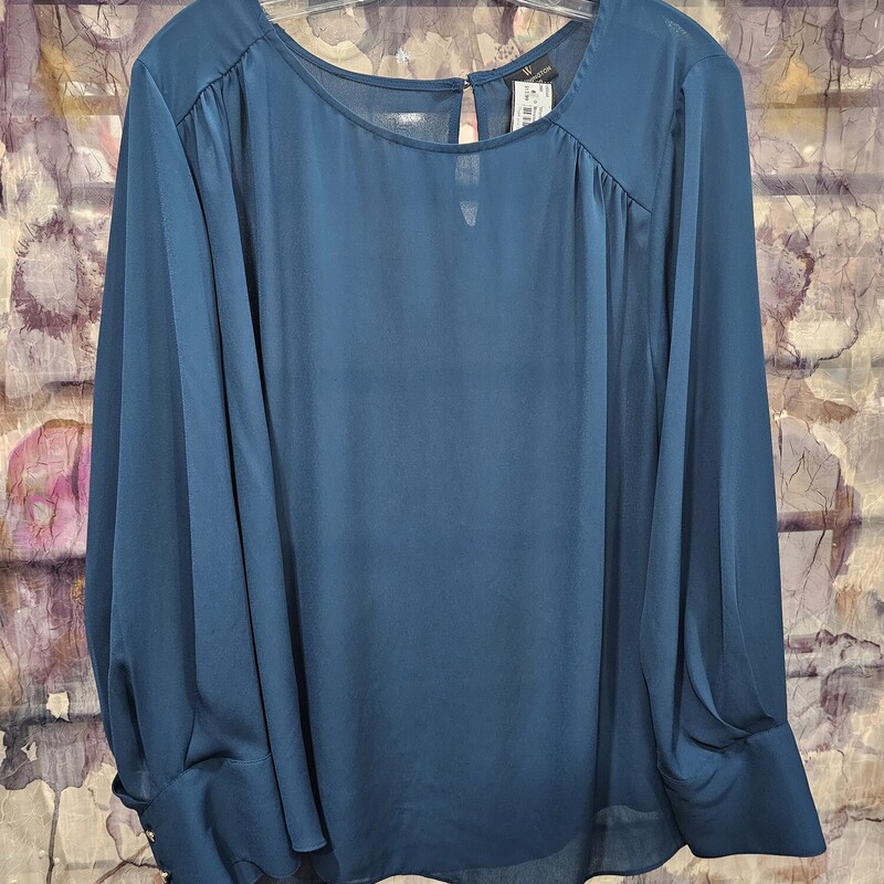 Wardrobe staple blouse in teal green. Can be dressed up or down.
