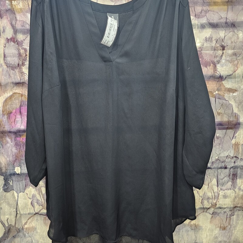 Wardrobe staple black blouse that can be dressed up or down.