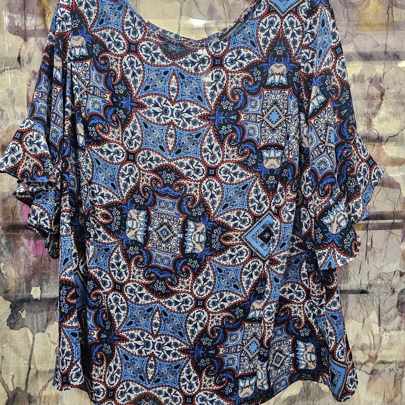 Cute red white and blue blouse in a paisley style print and ruffled half sleeves.