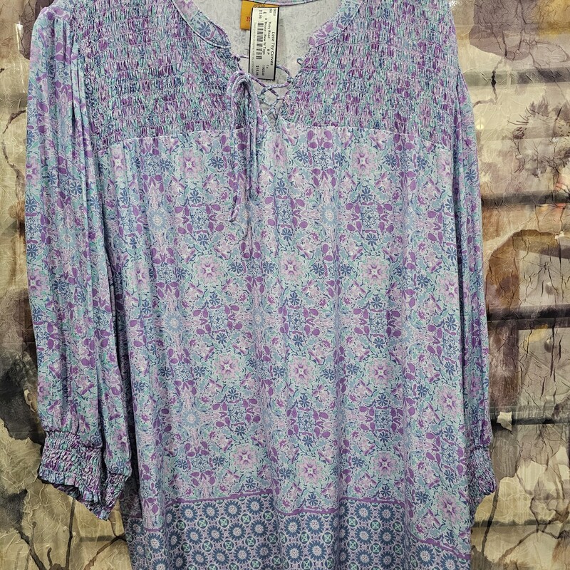 Brand new with tags and retails for $65, half to three quarter sleeve blouse in soft blues and purples