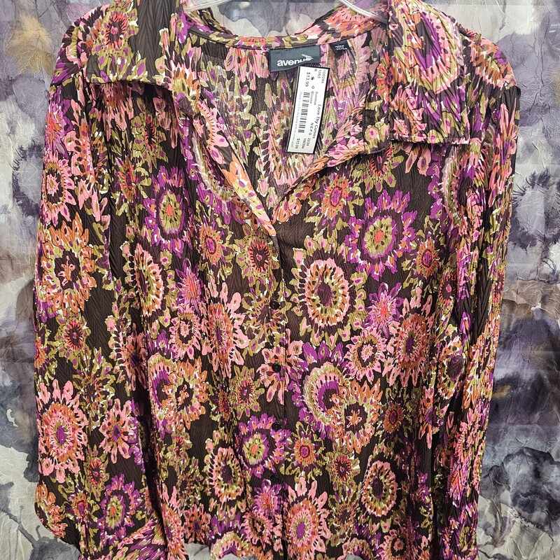 Button up sheer blouse in a fun bold print. Long sleeve and light weight.