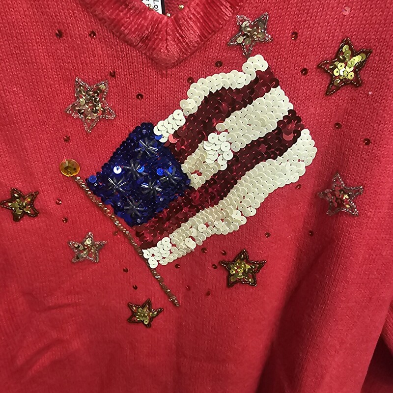 Long sleeeve patriotic sweater in red with sequined flag on the front.
