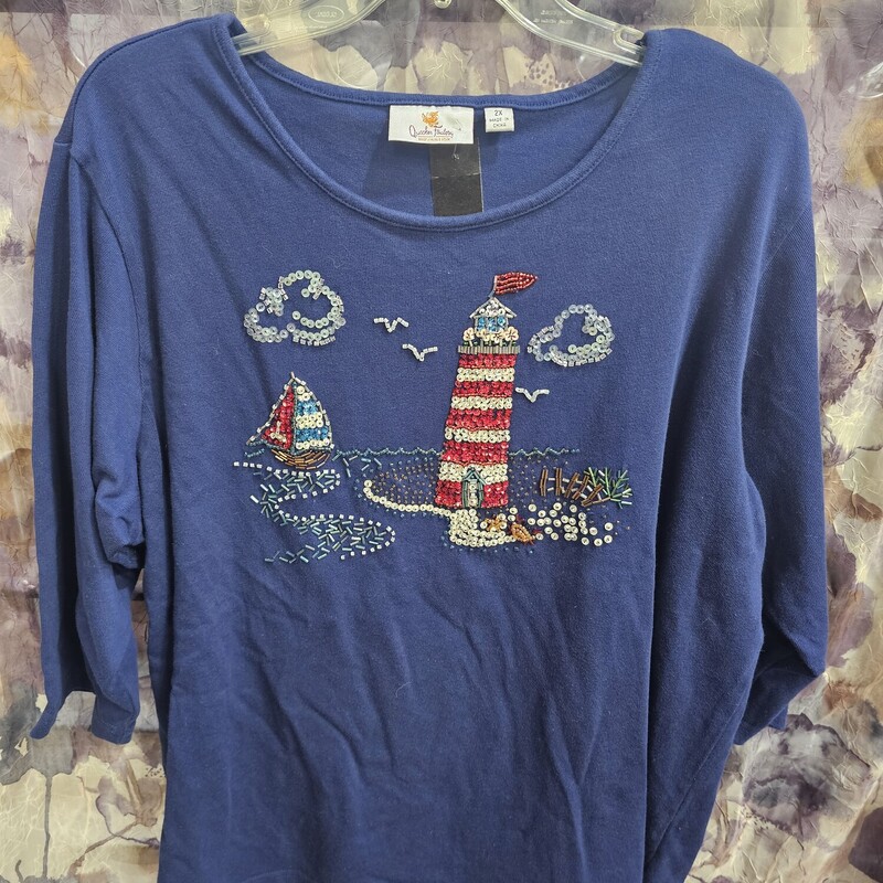 Half sleeve knit top in blue with sequin and beaded light house and beach scene