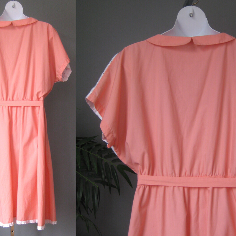 Shirt dress from the 1960s in a peach cotton poly blend.<br />
The top has short sleeves and a white eyelet inset detail.<br />
The waist is elasticized<br />
The skirt is quite full and has another eyelet inset.<br />
Pretty summery peach color.<br />
Unlined<br />
Buttons to the waist.<br />
Sash belt<br />
by Bridge Gate<br />
made in Taiwan<br />
<br />
This dress could fit a modern size 3X, pls use thhe measurements provided as your ultimate guide to fit.<br />
Flat measurements:<br />
armpit to armpit: aprox 44<br />
Waist: 20.5 stretches comfortabley to 24<br />
Hip: 29<br />
Length: 47<br />
<br />
Excellent condition.<br />
<br />
Thanks for looking!<br />
#3784