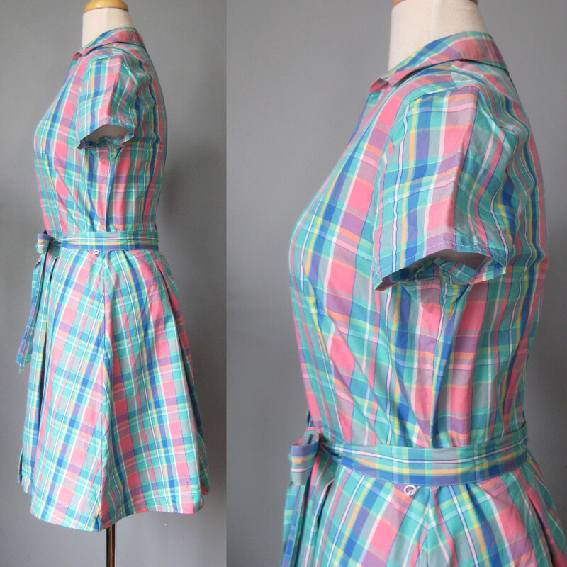 Perfect preppy summer dress from Brooks Brothers.<br />
It's made of smooth cotton poplin (like a shirting material) in a pretty blue and pink plaid.<br />
<br />
It buttons all the way open from the neck to the hem<br />
Short sleeves<br />
Pleated skirt<br />
Pockets<br />
removeable sash belt<br />
Marked size 12<br />
Flat measurements, pls double where appropriate:<br />
Shoulder to shoulder: 15.5<br />
armpit to armpit: 21.5<br />
waist: 17<br />
hip: 24<br />
length: 37<br />
75<br />
<br />
thanks for looking!<br />
#2592