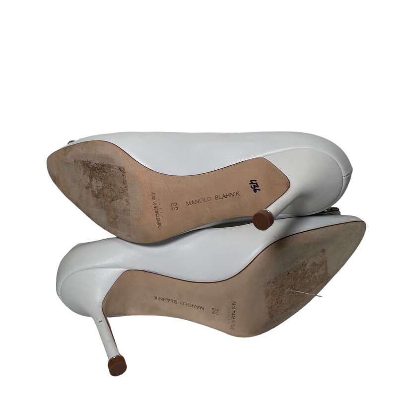 White Manolo Blahnik Hangisi Heels<br />
 Size:38<br />
Inspired by the opulence of a French emperor, this almond-toe leather pump holds court with a bejeweled buckle based on one that Manolo Blahnik<br />
Made in Italy.<br />
<br />
Toes show minor wear.