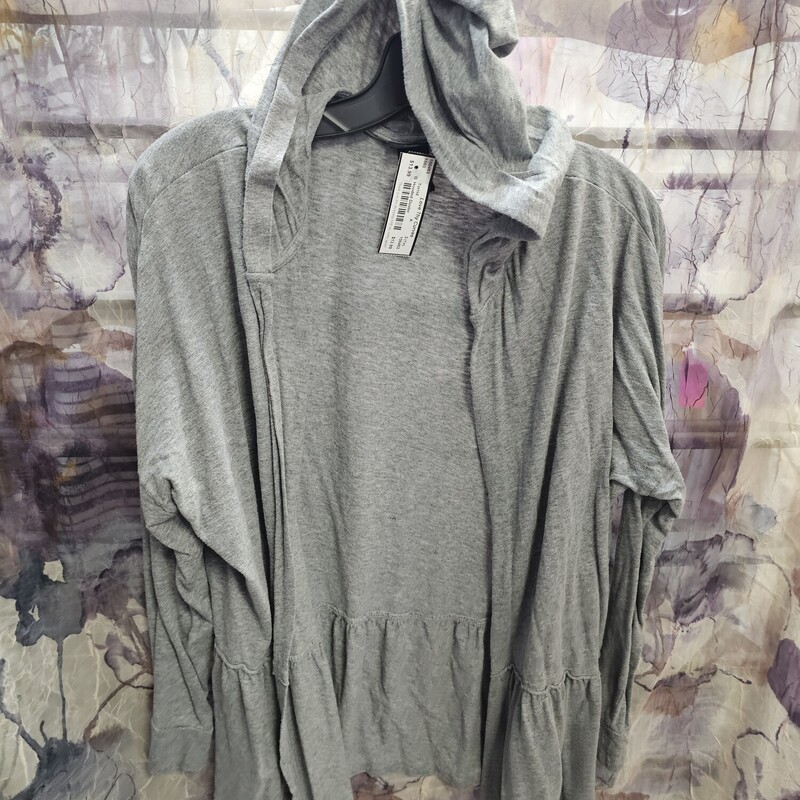 No close front waist length duster in grey knit with hood and ruffled waist.