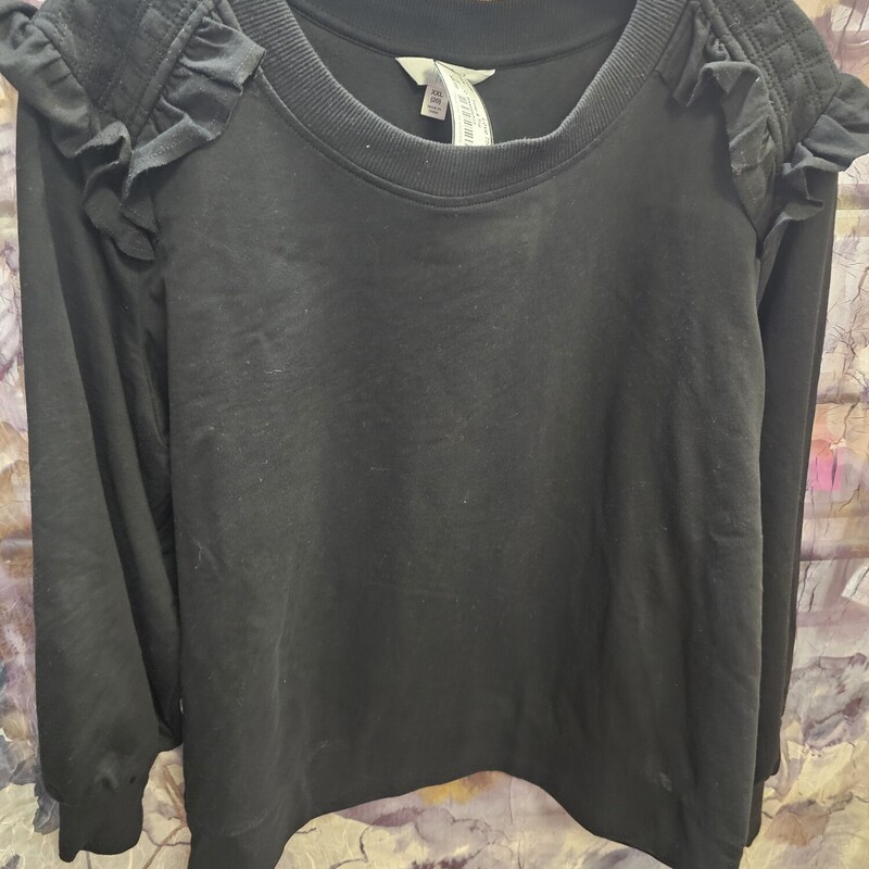 Lighter weight sweatshirt in black with ruffles on the shoulders