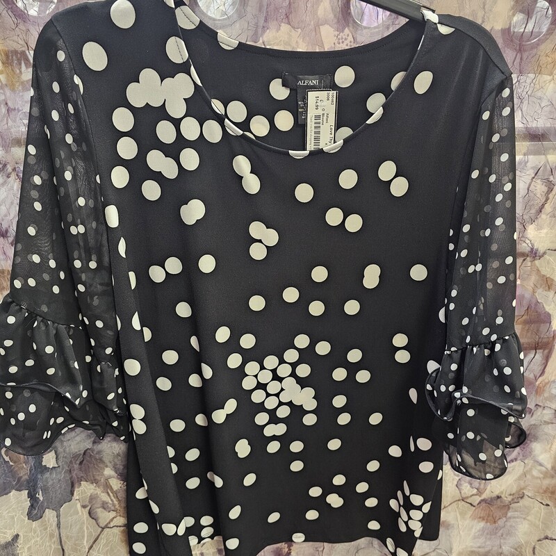 Suppppper cute! Black blouse with sheer sleeves, ruffles and white polka dots!