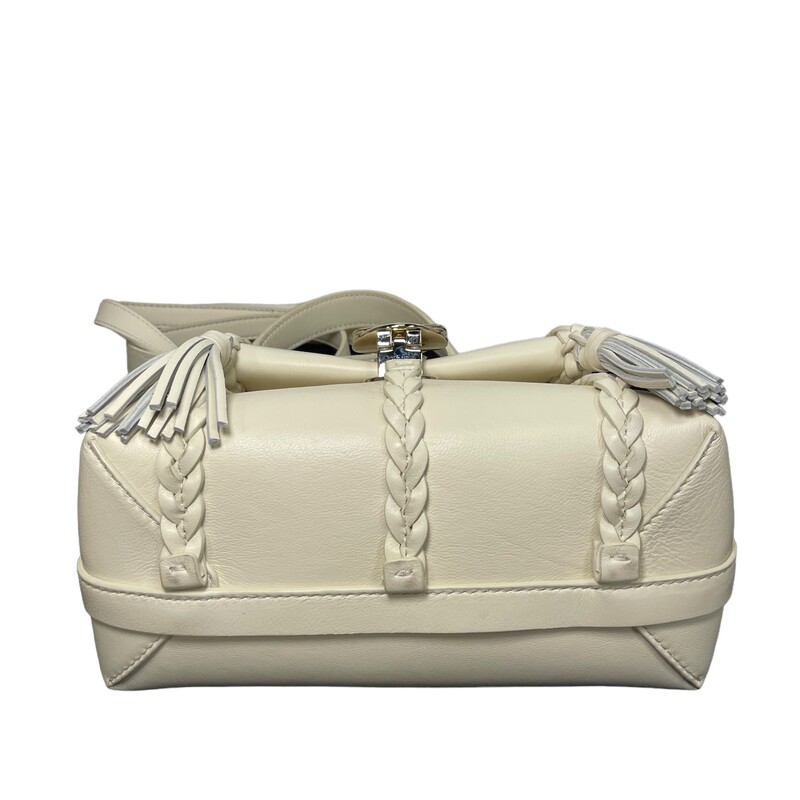 Chloe Penelope Soft Cream

Size: Mini

Dimensions:
5 1/2H x 9W x 3 1/2D. (Interior capacity: small.)
4 1/2 strap drop
19 strap drop
1.80lbs

Braiding and tassels bring Chloé's signature equestrian aesthetic to this softly structured satchel shaped from supple calfskin leather. This compact version comes with both a removable handle and crossbody strap for more carry options.