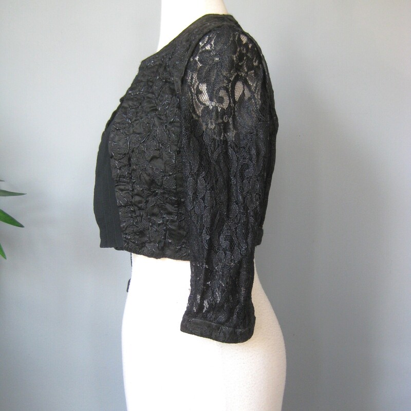 Karen Millen Lace Cropped, Black, Size: Medium<br />
Wear this shrug to finish your special occasion outfit without appearing frumpy.<br />
It's gorgeous and by fave European Brand<br />
Karen Millen.<br />
It's made of slightly sparkly, stretchy, puckery lace, lined on the bodice and sheer at the sleeves.<br />
The opening has no closures and is finished with layered black mesh.<br />
Marked size UK size  10 which is US size 6<br />
flat measurements:<br />
shoulder to Shoulder: 13<br />
armpit to armpit: 17<br />
length from back of neck to hem: 14.5<br />
perfect like new condition.<br />
<br />
thanks for looking!<br />
#1590