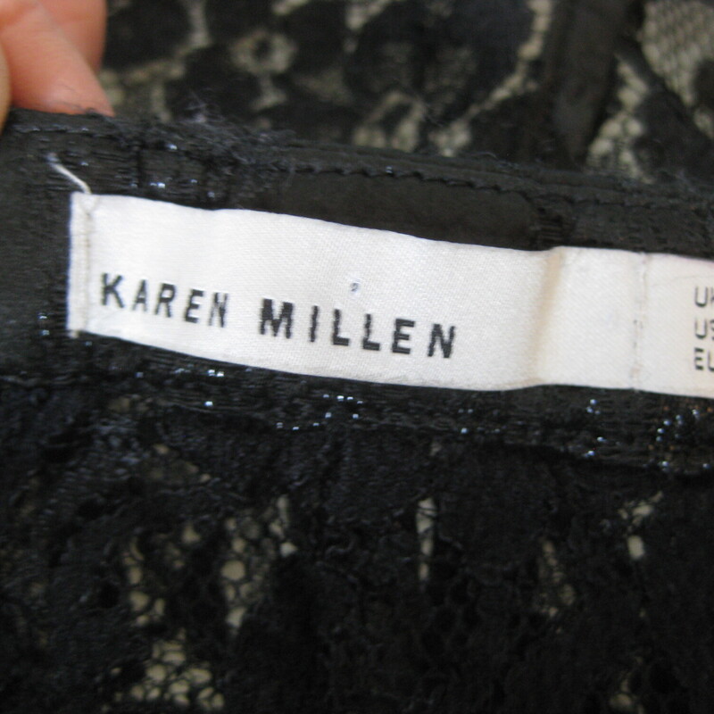 Karen Millen Lace Cropped, Black, Size: Medium<br />
Wear this shrug to finish your special occasion outfit without appearing frumpy.<br />
It's gorgeous and by fave European Brand<br />
Karen Millen.<br />
It's made of slightly sparkly, stretchy, puckery lace, lined on the bodice and sheer at the sleeves.<br />
The opening has no closures and is finished with layered black mesh.<br />
Marked size UK size  10 which is US size 6<br />
flat measurements:<br />
shoulder to Shoulder: 13<br />
armpit to armpit: 17<br />
length from back of neck to hem: 14.5<br />
perfect like new condition.<br />
<br />
thanks for looking!<br />
#1590