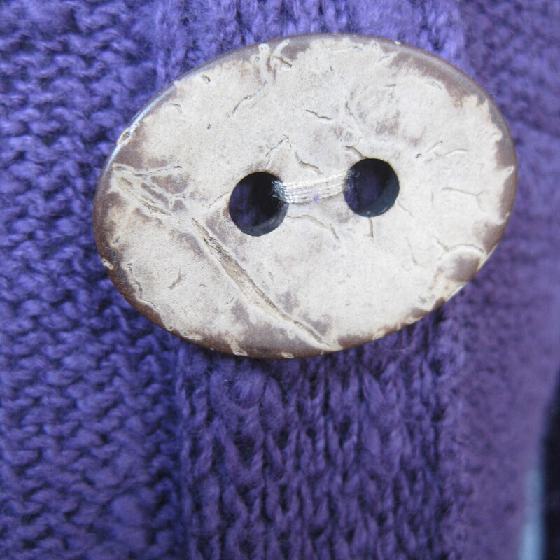 Habitat Chunky Wood Bttnd, Purple, Size: Small
Chic relaxed 100% cotton pullover sweater by
Habitat - clothes to live in.
It's a beautiful dark teal color.
The knit is drapey and knubby
It's a pullover NOT a cardigan,  But it looks like a cardigan because of the decorative oval wood look buttons arranged off center down the front.
The collar can be close with a loop over that top button, but the loop is a little stretched out.  Easy fit, I can take a crack at it for you if you wish.

 Marked size M
flat measurements:
shoulder to shoulder; 17.75
armpit to armpit: 20.25
width at hem: 20
length: 19
underarm sleeve seam: 15, this may seem a little short, but the shoulder seam will sit a little low, a little outside the shoulder.

Thanks for Looking!
#64680