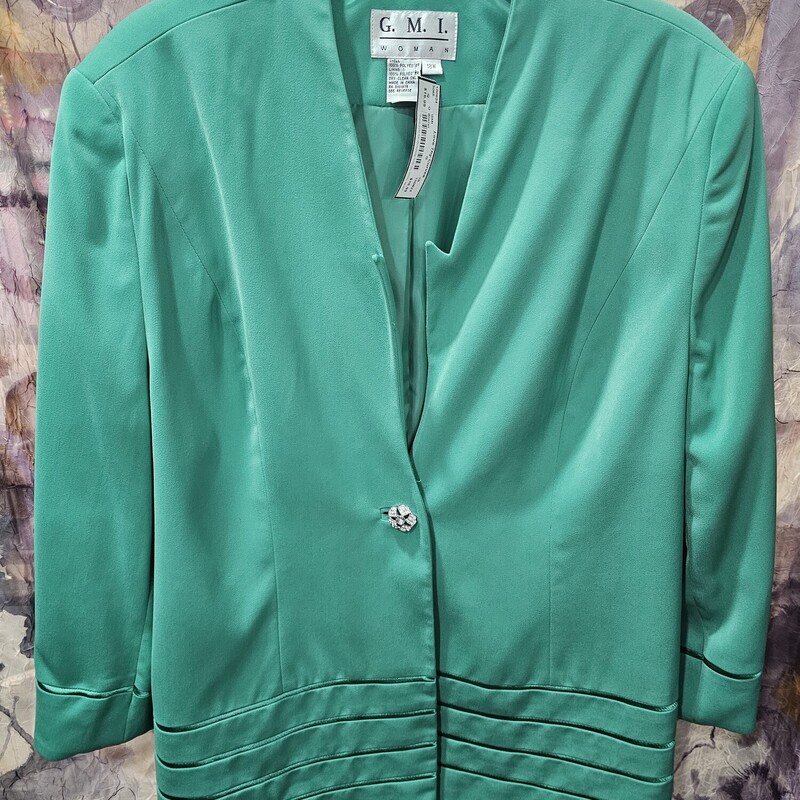 Beautiful longer waisted blazer in a brilliant green.