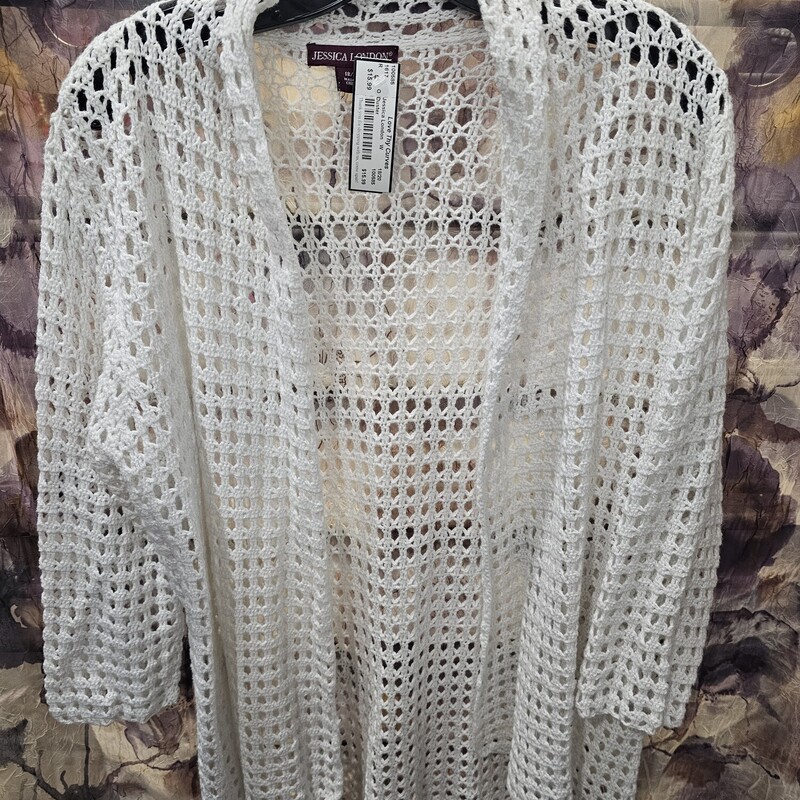 Love this half sleeve crocheted duster that will hit at the butt. in white